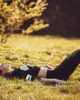 girl lying on the grass wearing legging